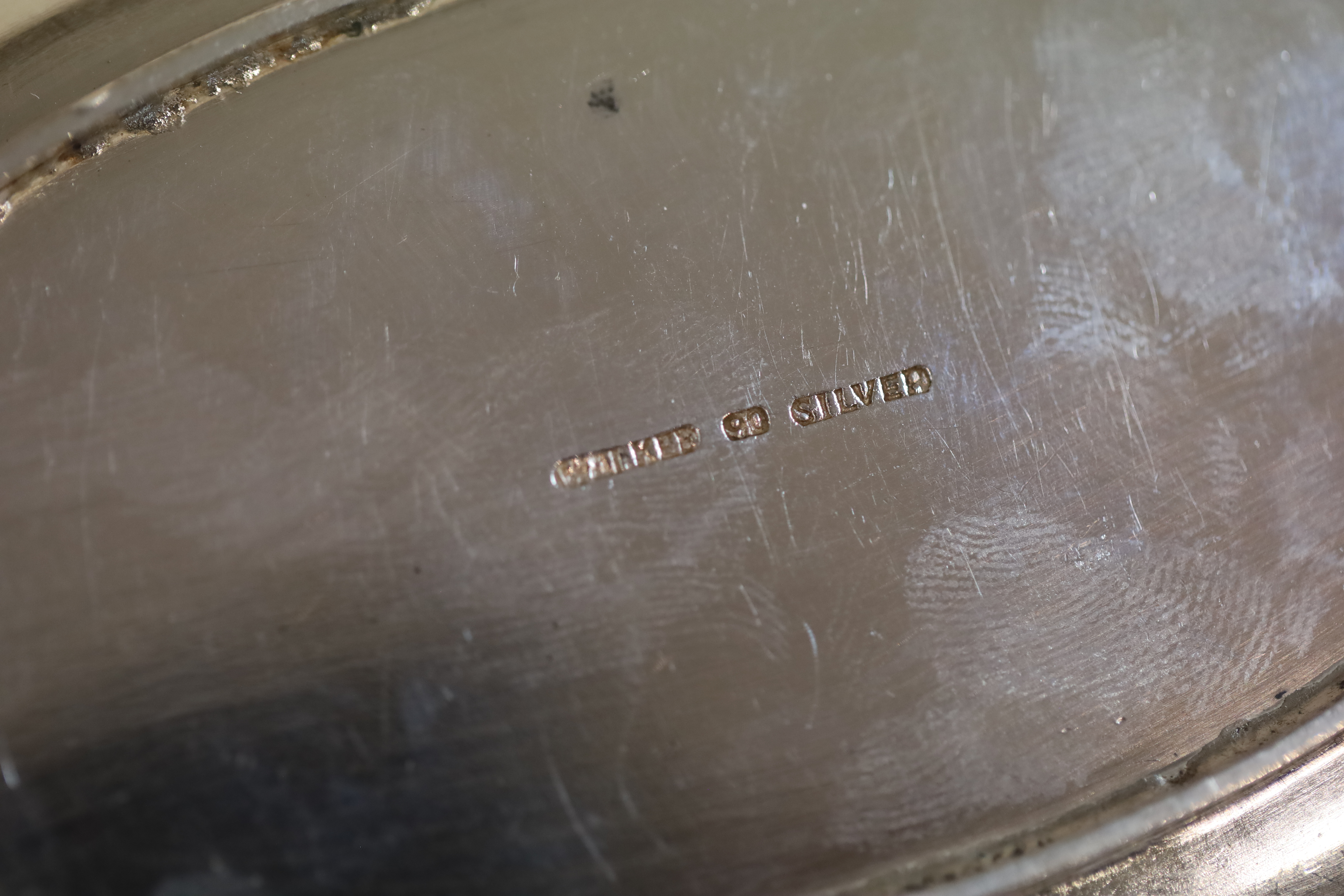 A Chinese white metal oval pen rest by Wai Kee, 12.7cm, 3.5 oz,